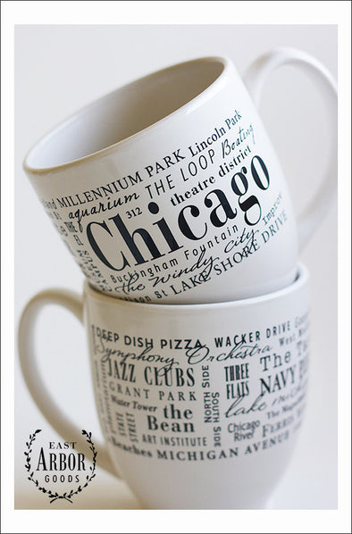 White ceramic coffee mug featuring Chicago, Illinois with places and activities featured in different fonts in black screen print.  