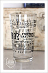 Right side view of Pint Glass featuring Ann Arbor, Michigan with highlights from the town in black screen print