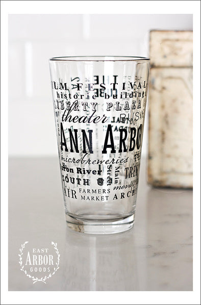 Pint Glass featuring Ann Arbor, Michigan with highlights from the town in black screen print