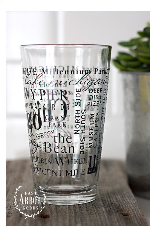 Right side view of Pint Glass featuring Chicago, Illinois with highlights from the town in black screen print.