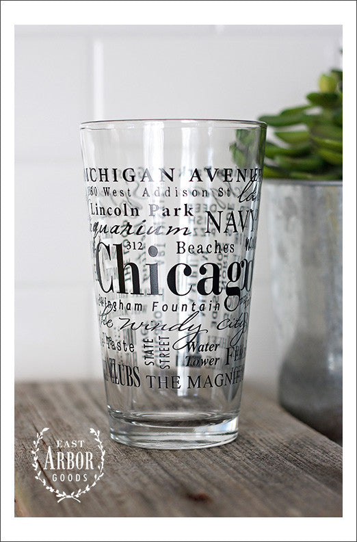 Pint Glass featuring Chicago, Illinois with highlights from the town in black screen print.