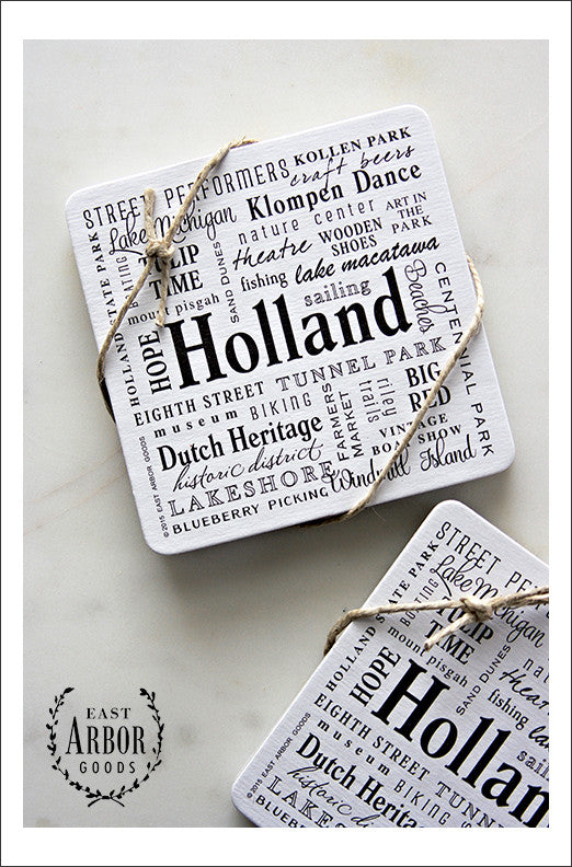 Two sets of drink coasters each tied with decorative twine shown featuring Holland, Michigan. Each set comes with 6 thick cardstock coasters with words in different fonts and sizes in black screen print. 