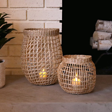 All included, Hand-woven Seagrass Lanterns, Glass Candle Holders, and Faux Flickering Votives, Set of 2