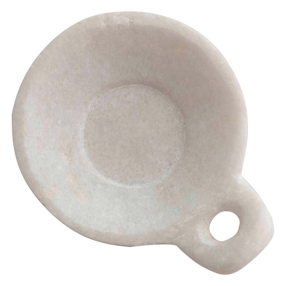 Close up of white marble dish. 