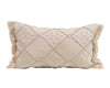 Cream cotton-linen pillow with designs of diamonds made from cream thread dots. The two sides of the pillow have fringe detail with cream thread. 