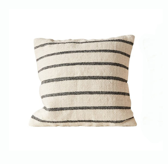 Large cream colored wool woven pillow with thin gray stripes on a white background. 