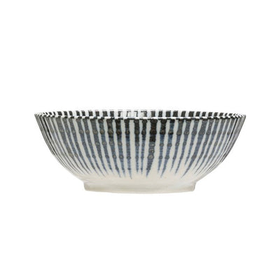 White porcelain bowl with vibrant blue ribbon design on a white background.