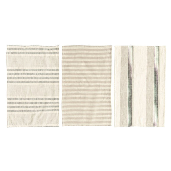 Three cream cotton kitchen towels laid out to show the different woven stripped patterns. The towels are on a white background. 